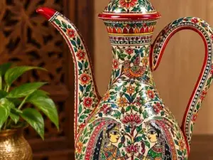 Handpainted Mithila decorative pitcher featuring traditional Madhubani art, floral motifs, and cultural illustrations on a handcrafted vase.