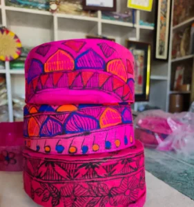 Pink Mithila Paag with traditional colorful artwork